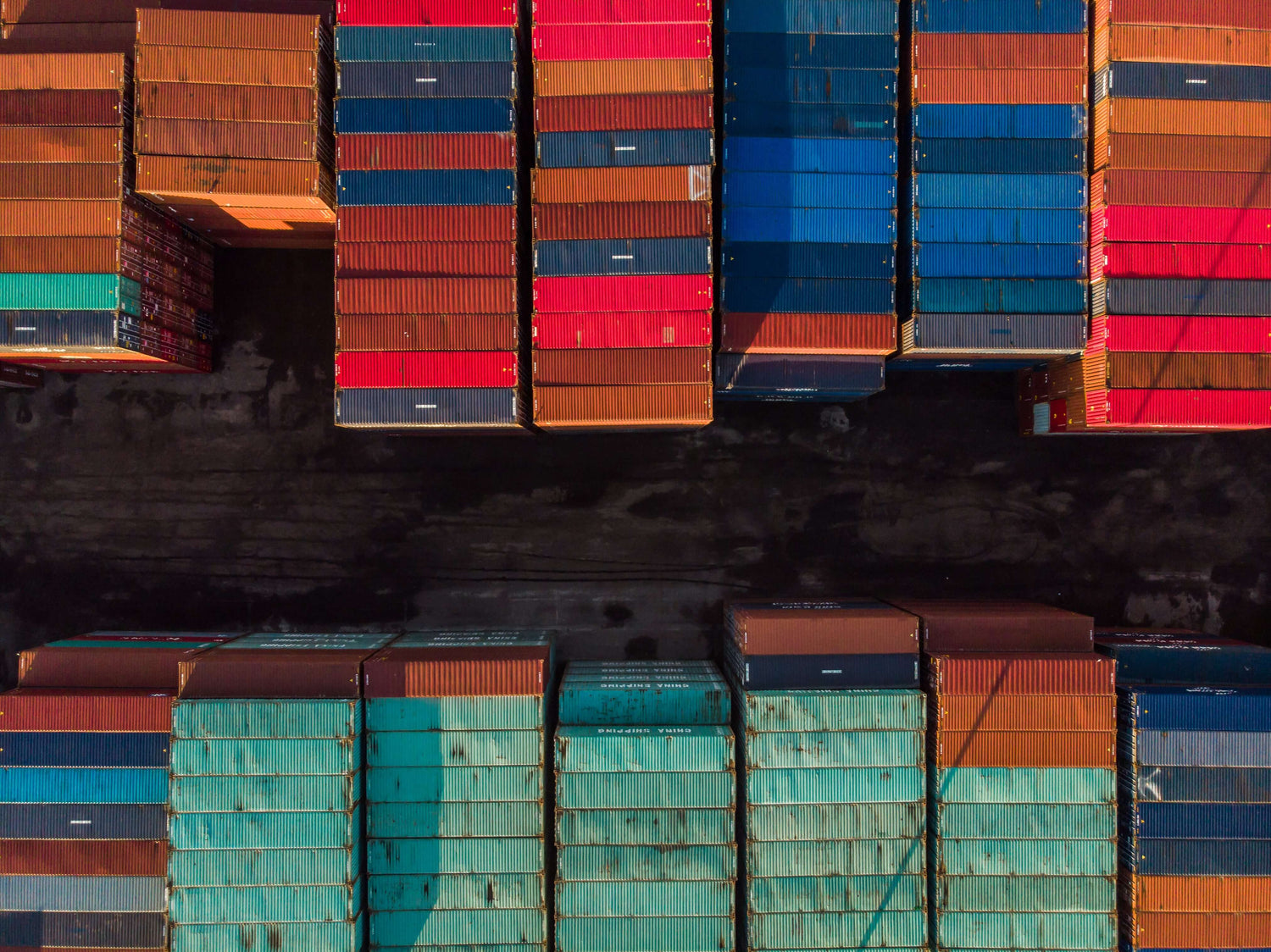 two-rows-of-stacked-shipping-containers.jpg Wear To Go